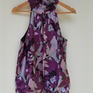 Sleeveless blouse will look great with shorts or jeans or slacks!